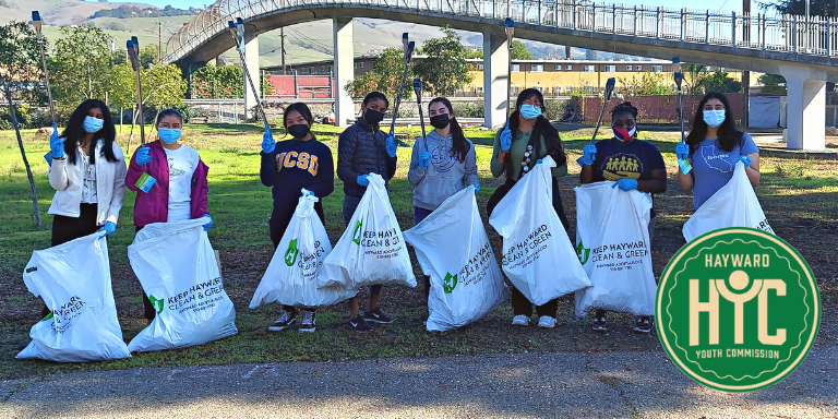Photo of Hayward Youth Commissioners during a litter pick up event outside.
