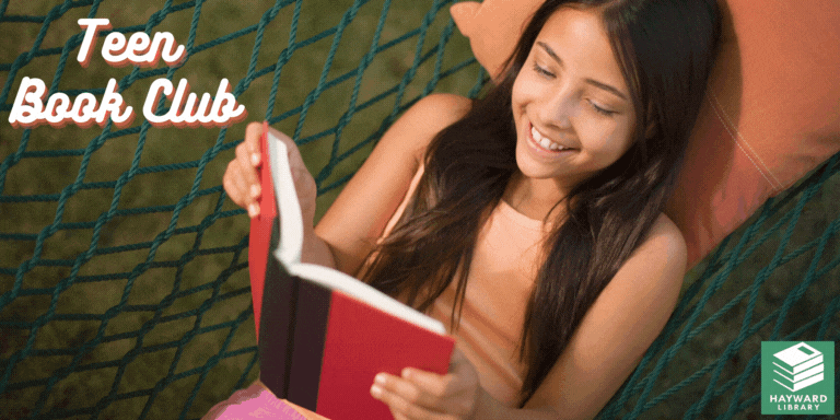 A girl reading a book in a hammock