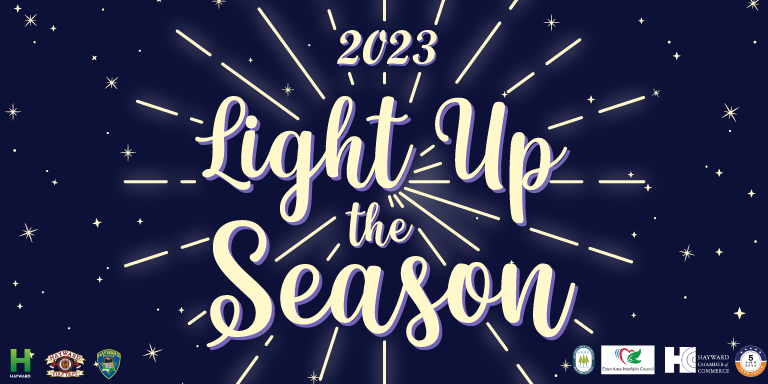 Navy blue graphic with white text surrounded by stars that says: Light Up the Season