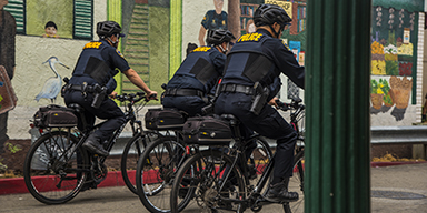 A group of police officers riding their bicycles in Downtown Hayward