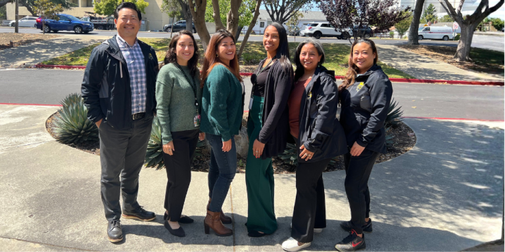 Youth Service Center staff standing in front of the Hayward Police Department