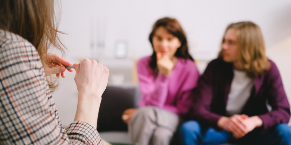 A family talking to a counselor