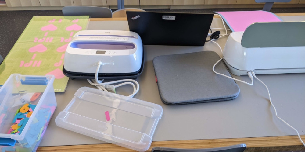 lamination equipment next to a cricket machine in the makerspace