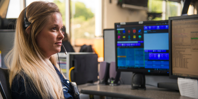 a woman working in the dispatch center