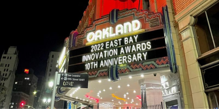 Photo of the marquee outside of the Fox Theater lit up at night. Marquee reads: 2022 East Bay Innovation Awards 10th Anniversary