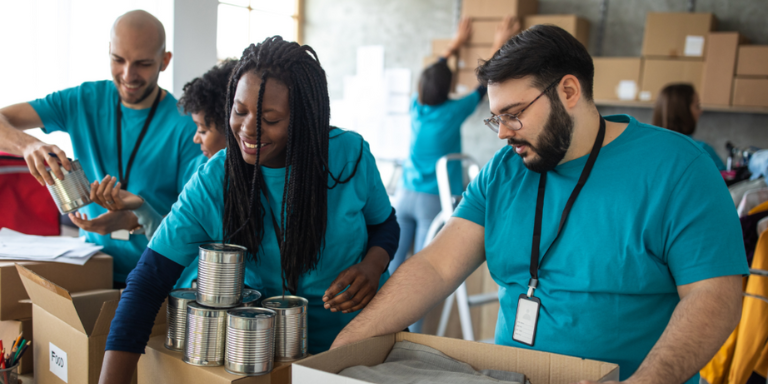 Volunteers packing sorting donated food