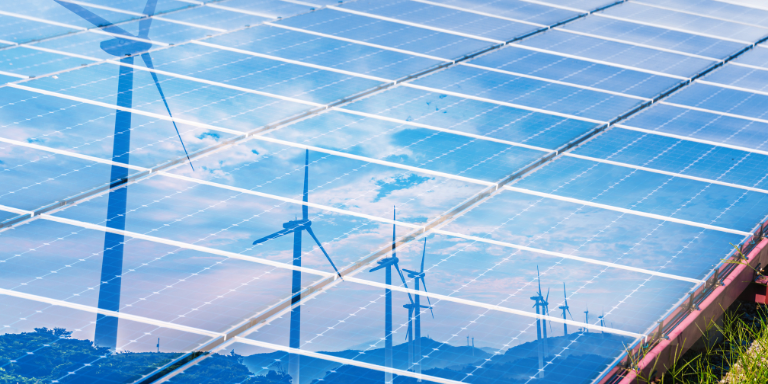 Windmills reflected on solar panels