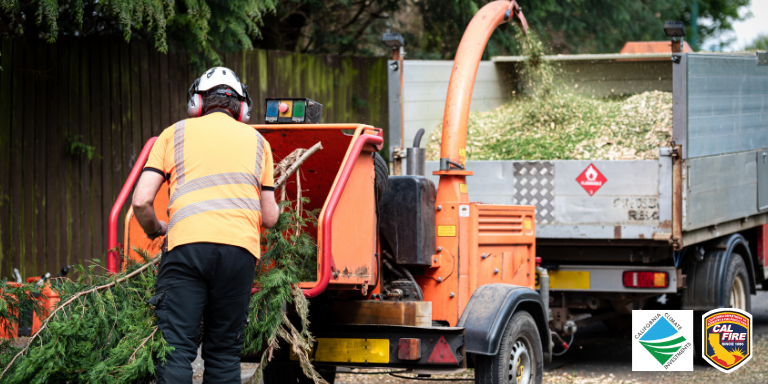Image of a person putting a branch through a wood chipper with the Cal Fire and the California Climate Investments logos.